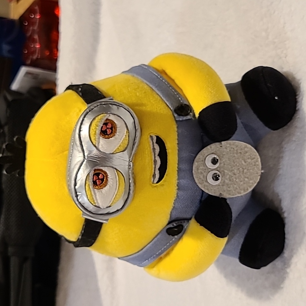 Minions: The Rise of Gru Otto Smitten stuffed toy.